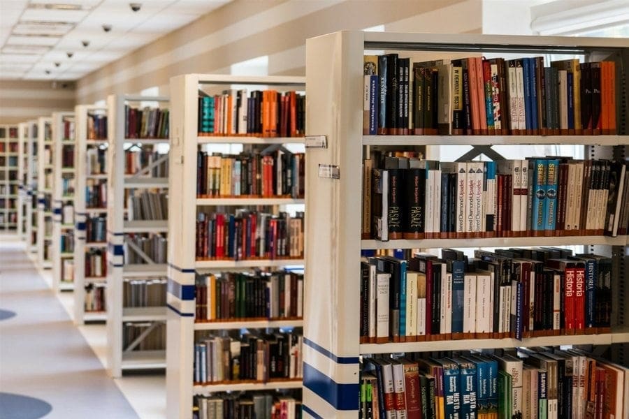 A row of bookshelves in a library providing ample storage for books and resources. A row of bookshelves in a library providing ample storage for books and resources.
